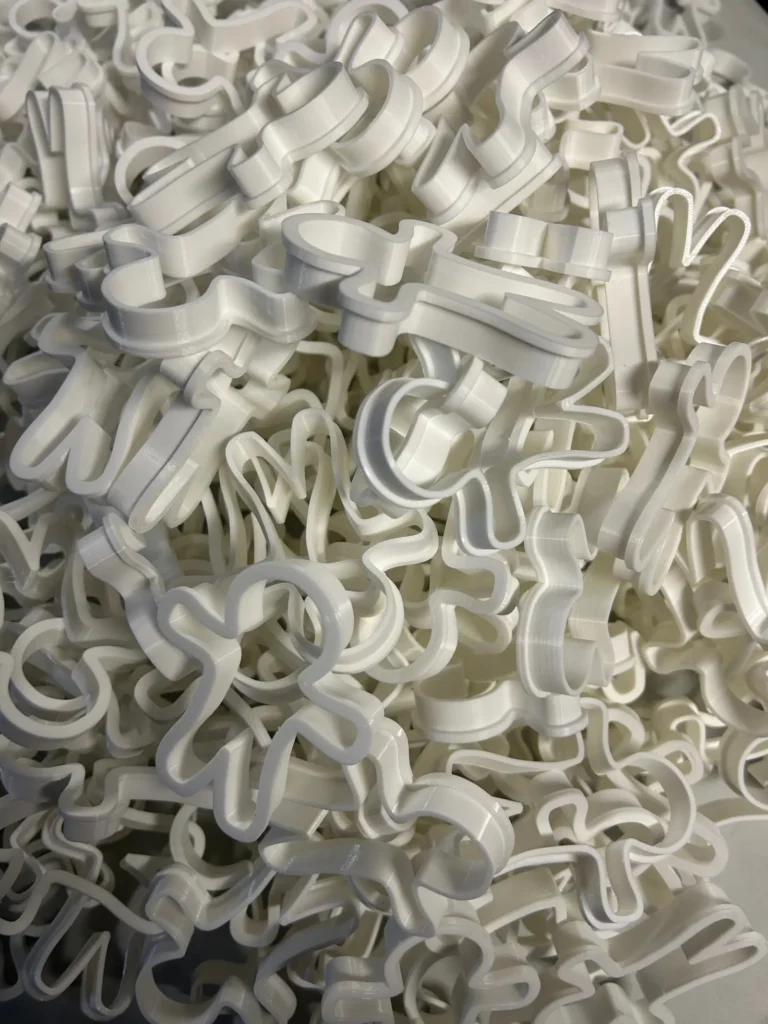 Batch of 3D printed cookie cutters from a 6,100-unit production run